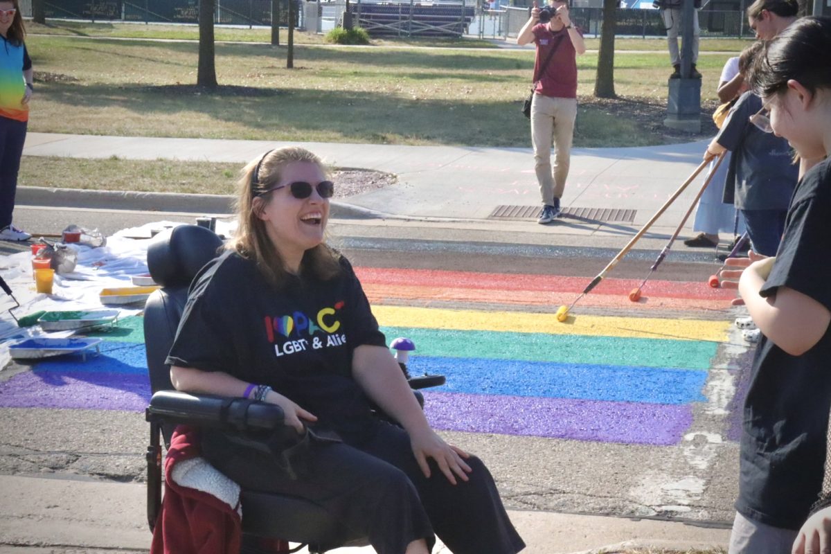 Katie Gruber, an Early Childhood Education Major smiles at Impact’s annual crosswalk painting, Tuesday afternoon, September 17, 2024.
