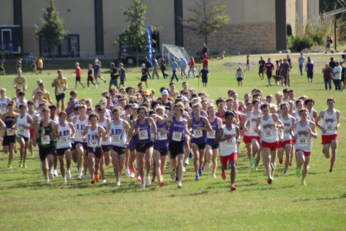 UW-Whitewater men's cross country team running at the start of the Tom Hoffman Invitational in Whitewater, Wisconsin Sept. 21, 2024.