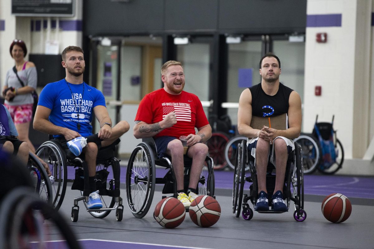 Team USA members, from left, Talen Jourdan, Jeromie Meyer and Jake Williams, watch a practice at the UW-Whitewater Warhawk Wheelchair Basketball Camp.