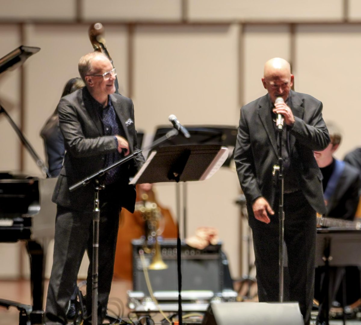 Scott Wendholt (guest artist, left) and Dr. Michael Hackett (right) introduces the next songs for the second half of the concert during the Jazz I Ensemble on Oct. 17, 2024. 