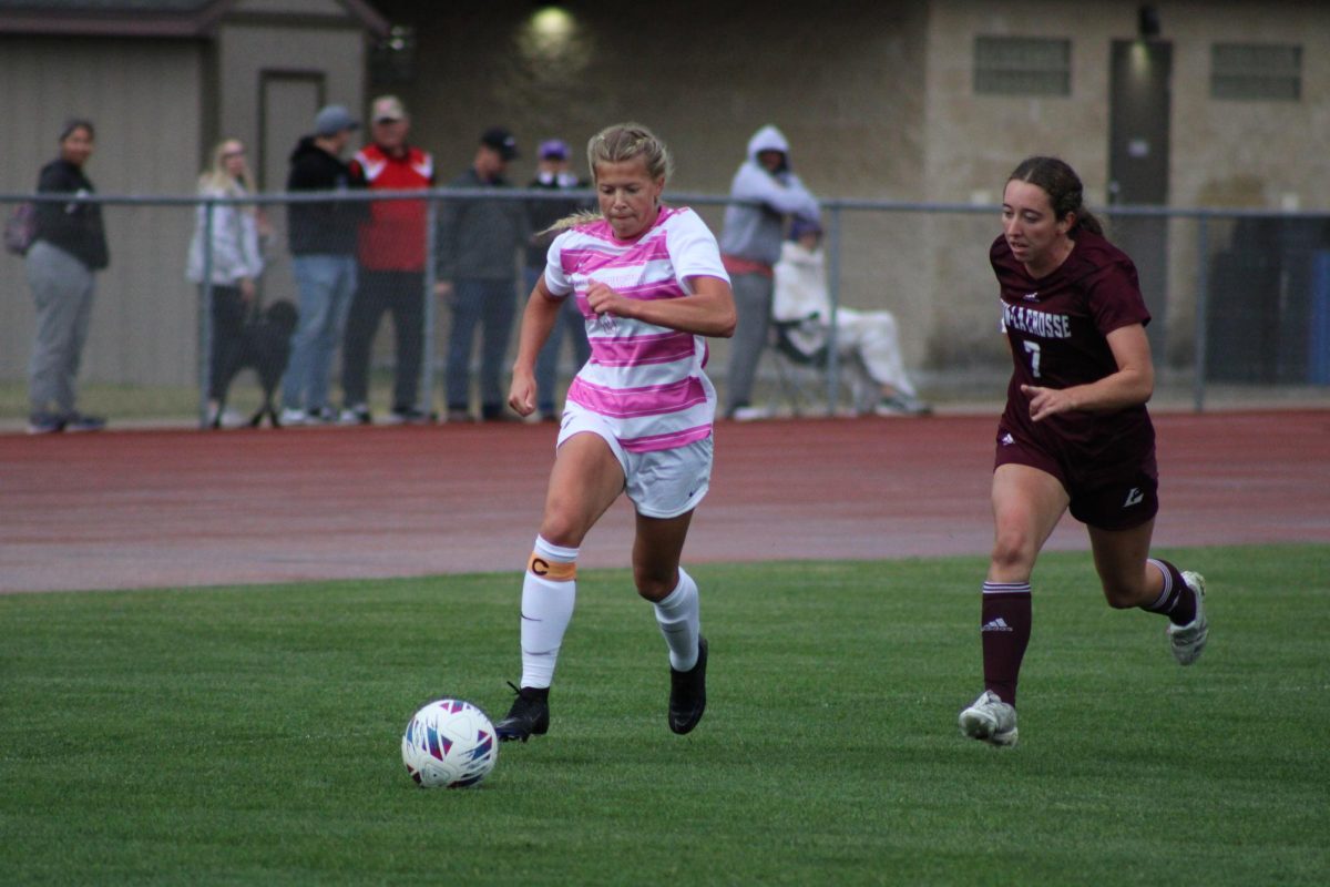 UW-Whitewater senior midfielder Brittany Ellinghaus (No. 8) attacking the ball against UW-La Crosse senior defender Alexis McMahon (No. 7) in the first half of the Saturday, Oct. 12 game between the Warhawks and the Eagles at Fiskum Field in Whitewater, Wisconsin.