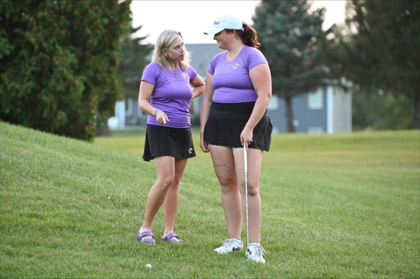 Myers and UW-Whitewater golf head coach Andrea Wieland talking things over between swings. 