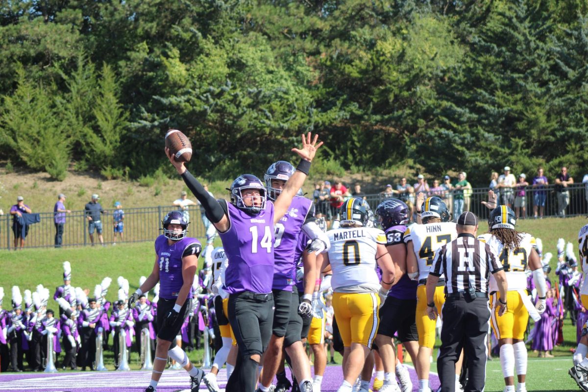 Quarterback Jason Ceniti celebrating scoring a touchdown for the Whitewater team, Saturday October 5, 2024.

