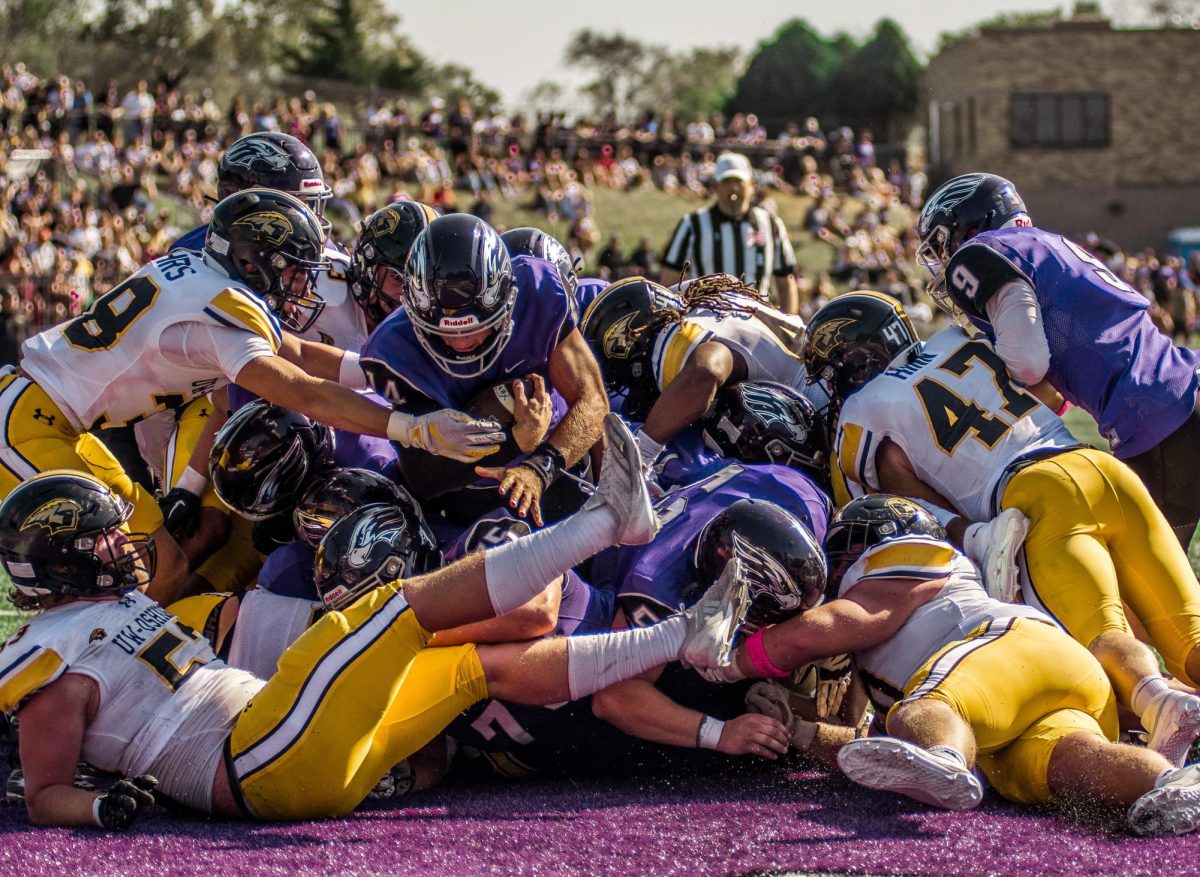 Quarterback, Jason Ceniti diving into the endzone against UW-Oshkosh at Perkins Stadium Oct. 5th, 2024.