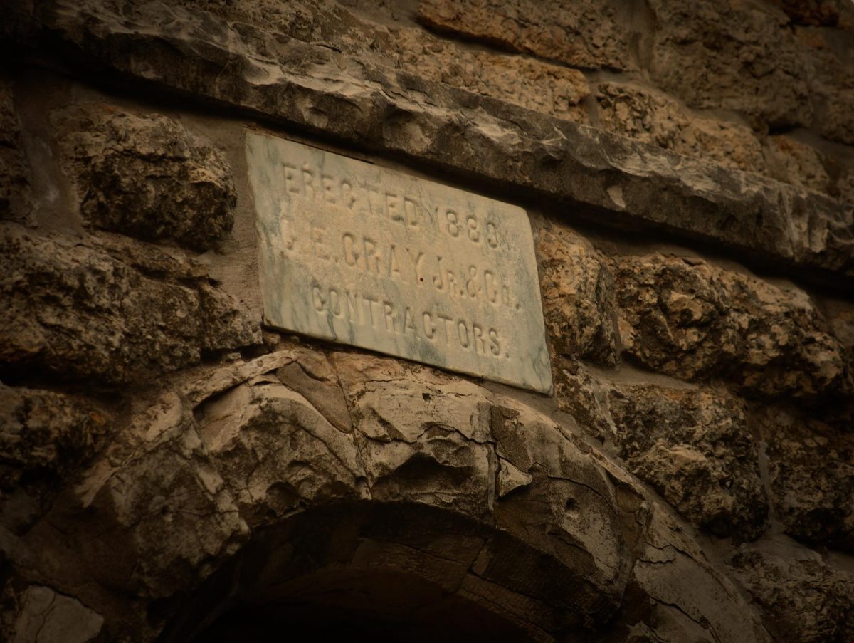 A stone sign on the water tower, also known as the "Witching Tower", in Whitewater. 