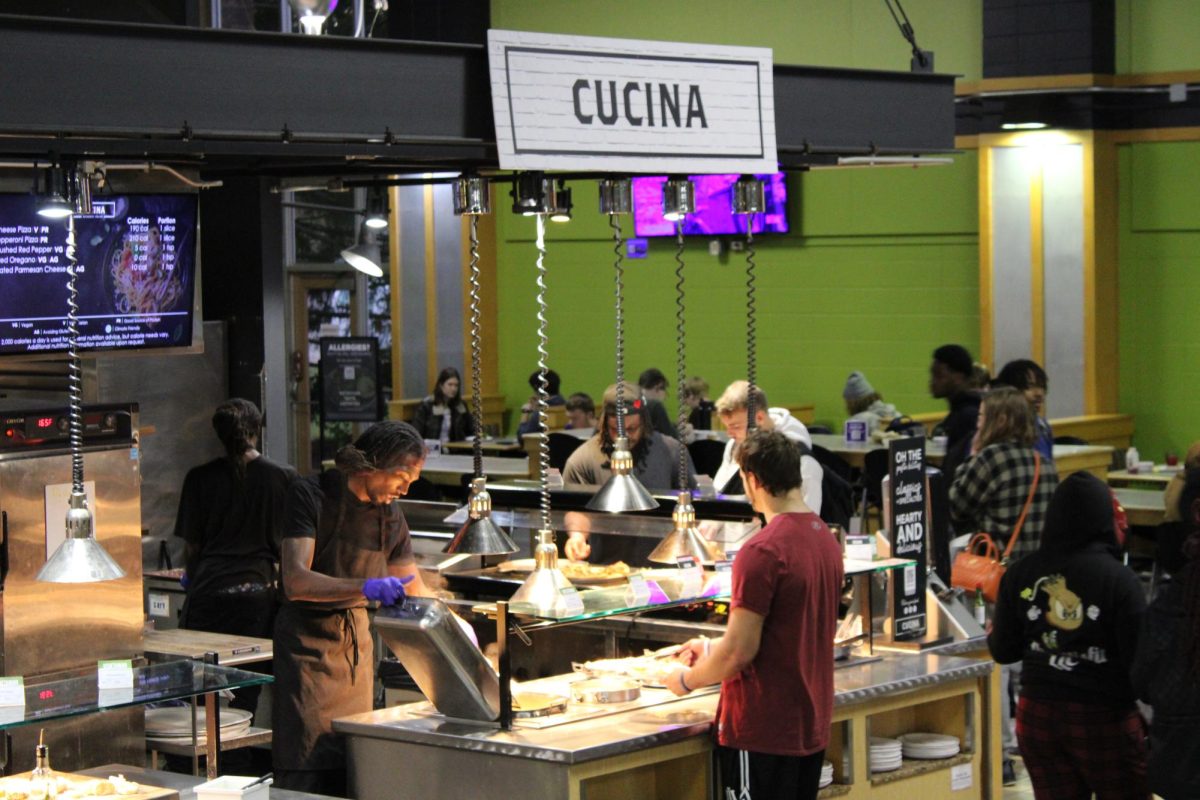 Esker Dining Hall food service workers dish out fresh meal opportunities at the Cucina, October 2024.