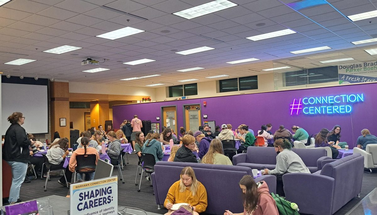 UW-Whitewater students  gather at the Warhawk Connection Center in UW-Whitewater’s University Center to paint mugs and plates Oct. 22 2024. 