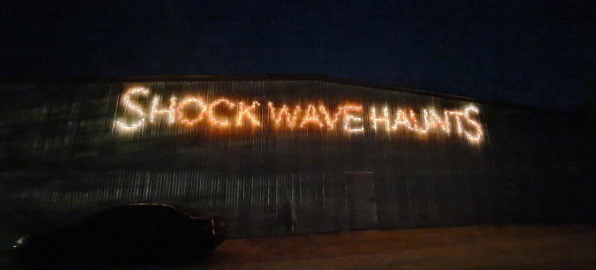 The light up sign for Shockwave Haunts, a haunted house  at The Fuzzy Pig located outside of the city of Whitewter, shines bright for visitors Oct. 11 2024. 

