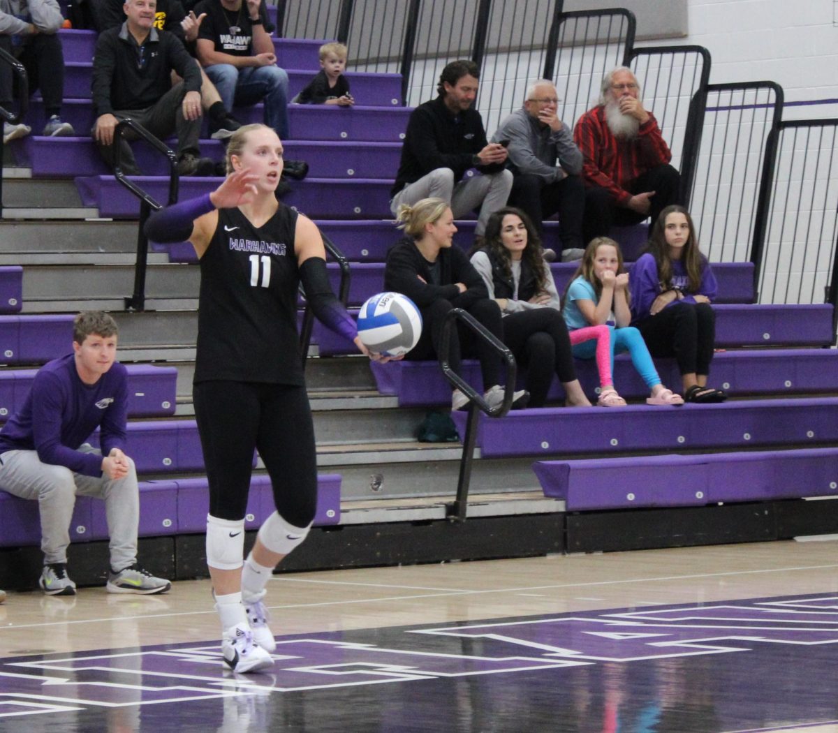 UW-Whitewater women’s volleyball player Alayna Jansky about to serve against UW-Stevens Point in Whitewater's Kris Russell Volleyball Arena Oct. 16 2024.