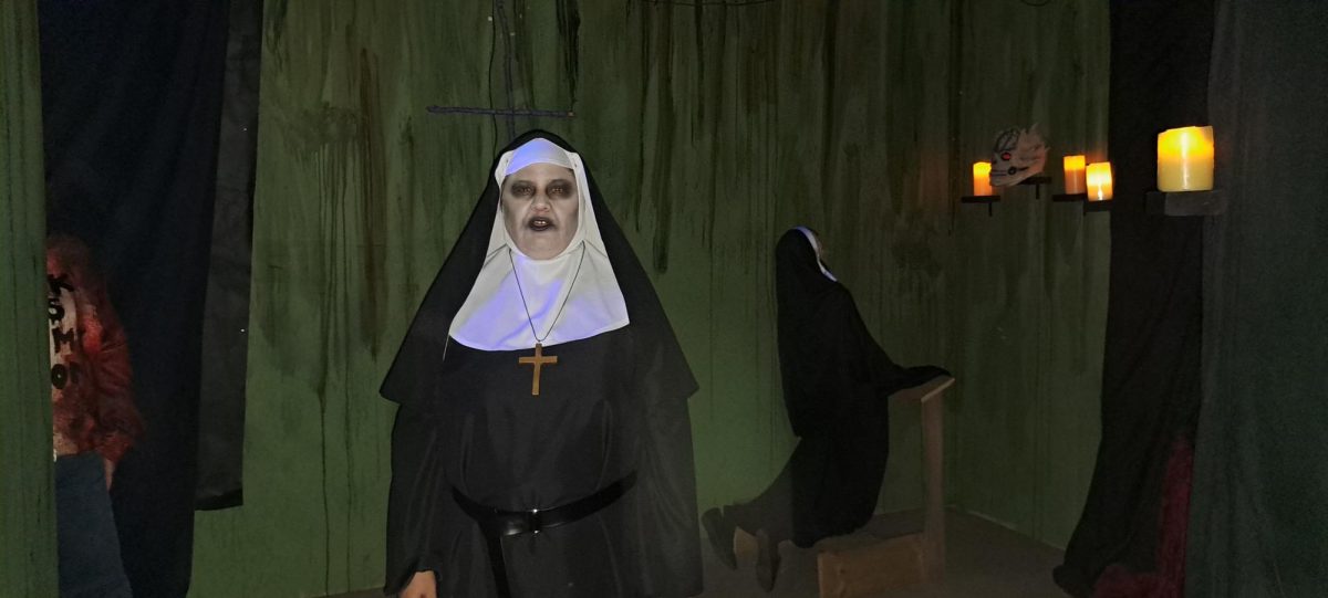 Scare actor Carrie Pope Mathison, who is dressed as a nun awaits to scare its next person at Shockwave Haunts located at The Fuzzy Pig Oct. 11 2024.