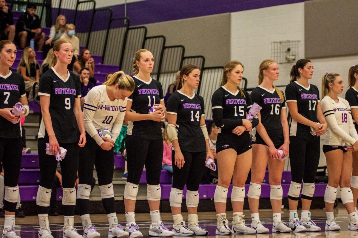 Warhawk volleyball lining up before their match against UW-Eau Claire at the Kriss Russel Volleyball gymnasium Oct. 4th, 2024. (Left to Right: Ava Rebarchik, Sienna Roling, Jaedynn Evans, Alayna Jansky, Kate Bahrke, Ally Warburton, Amanda Hillmann, Jenna Weinfurt, Rylee Braunschwieg.