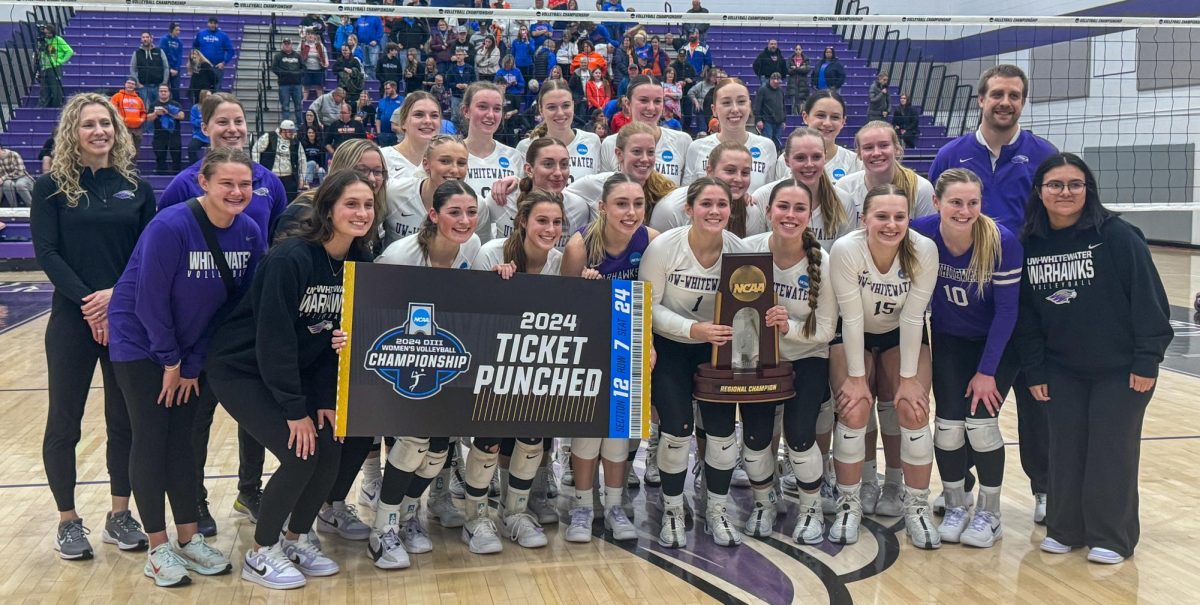 UW-Whitewater poses with their new hardware inside Kris Russell Volleyball Arena, Saturday, Nov. 23, 2024. By beating UW-Platteville in the Regional Championship sends the Warhawks to the final eight in Salem, Virginia. 