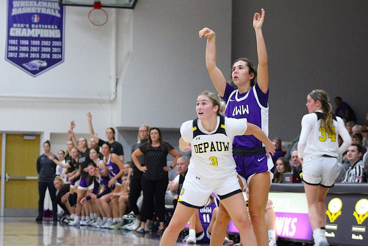 Senior guard Kacie Carollo pulls up from beyond the arc against DePauw’s senior guard Ava Hassel (3) in their Nov. 8 game against the Tigers at Kachel Gymnasium. Carollo stuffed the stat sheet with 19 points on 50% field-goal percentage, 5 assists, 4 rebounds, 2 steals, and a block against DePauw.