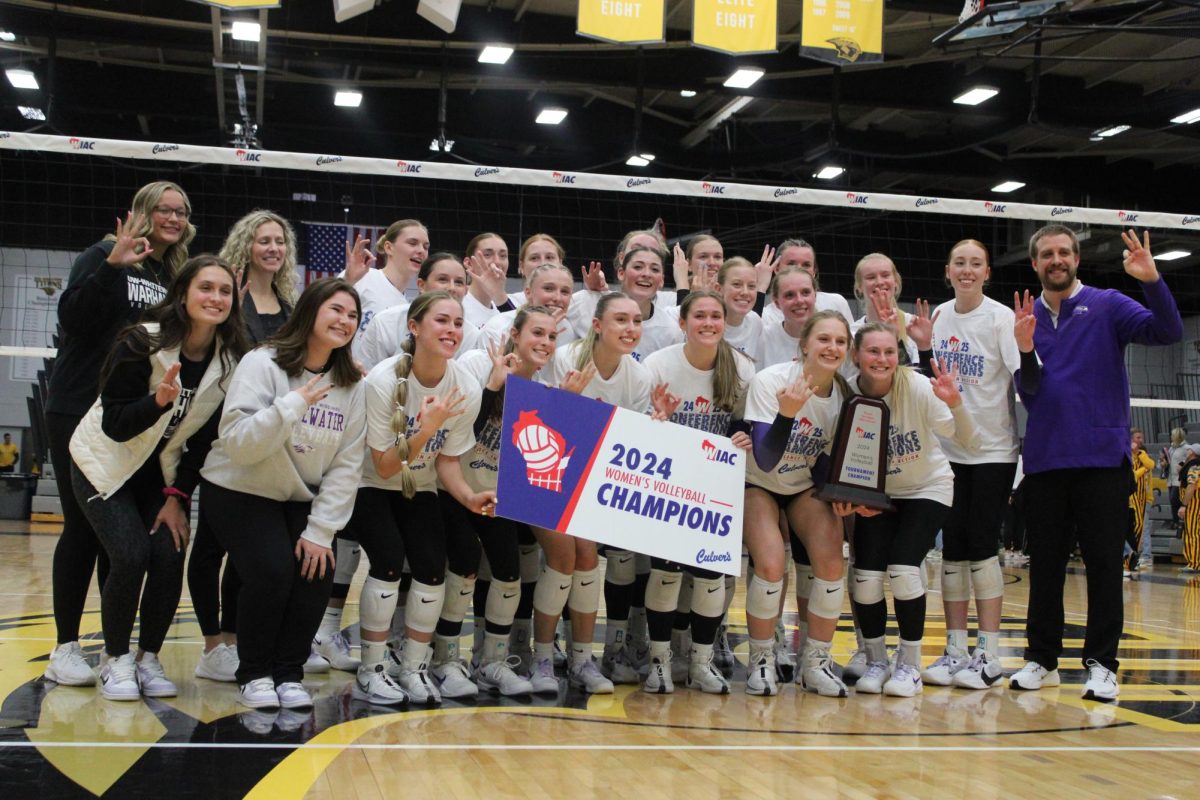 The third-seeded UW-Whitewater volleyball team posing for a photo after winning the 2024 WIAC Volleyball Championship in five sets against the first-seeded UW Oshkosh Titans at Kolf Sports Center in Oshkosh, Wisconsin. 