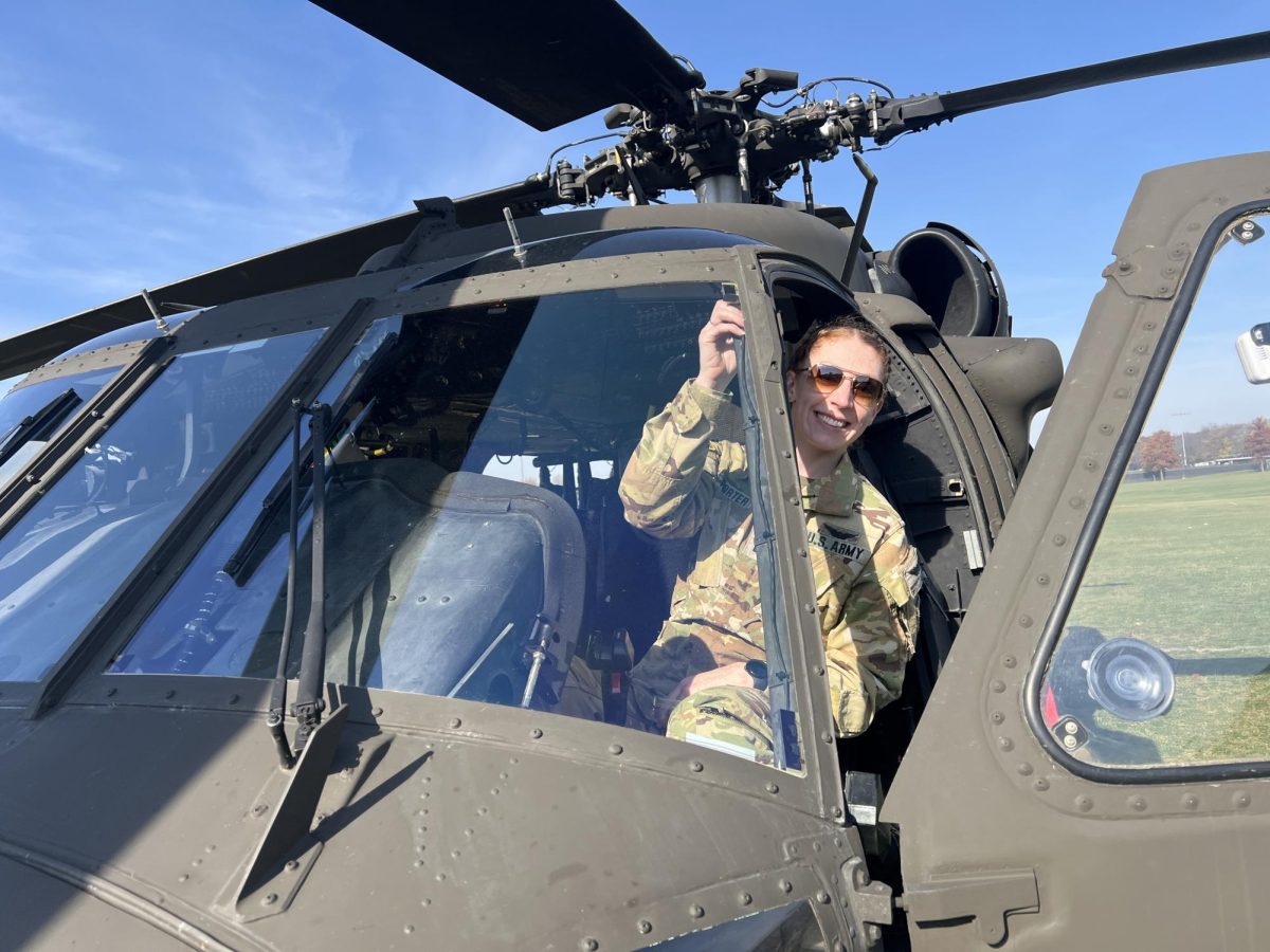 Capt. Meredith L. Porter inside the cockpit of the Blackhawk helicopter, October 2024. 