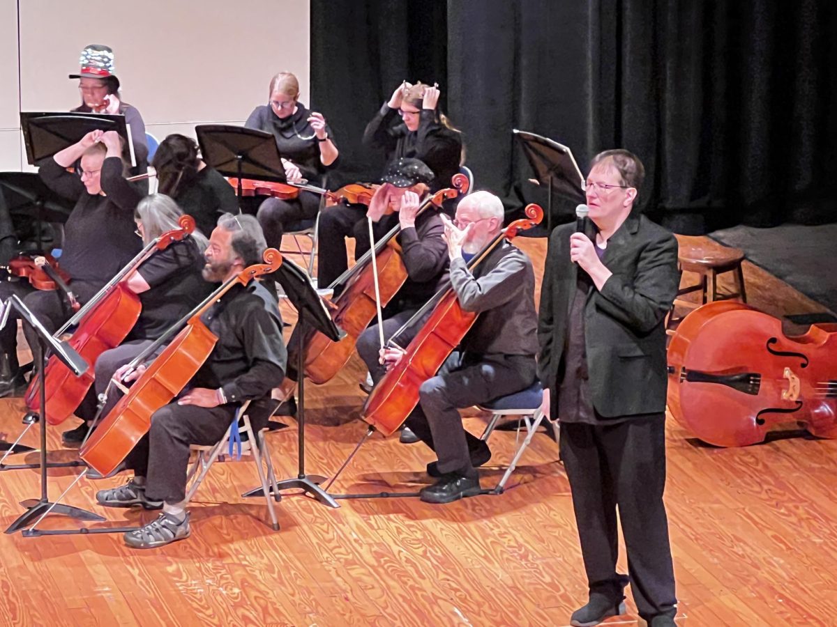 Conductor Jeff Suarez giving a speech to the audience