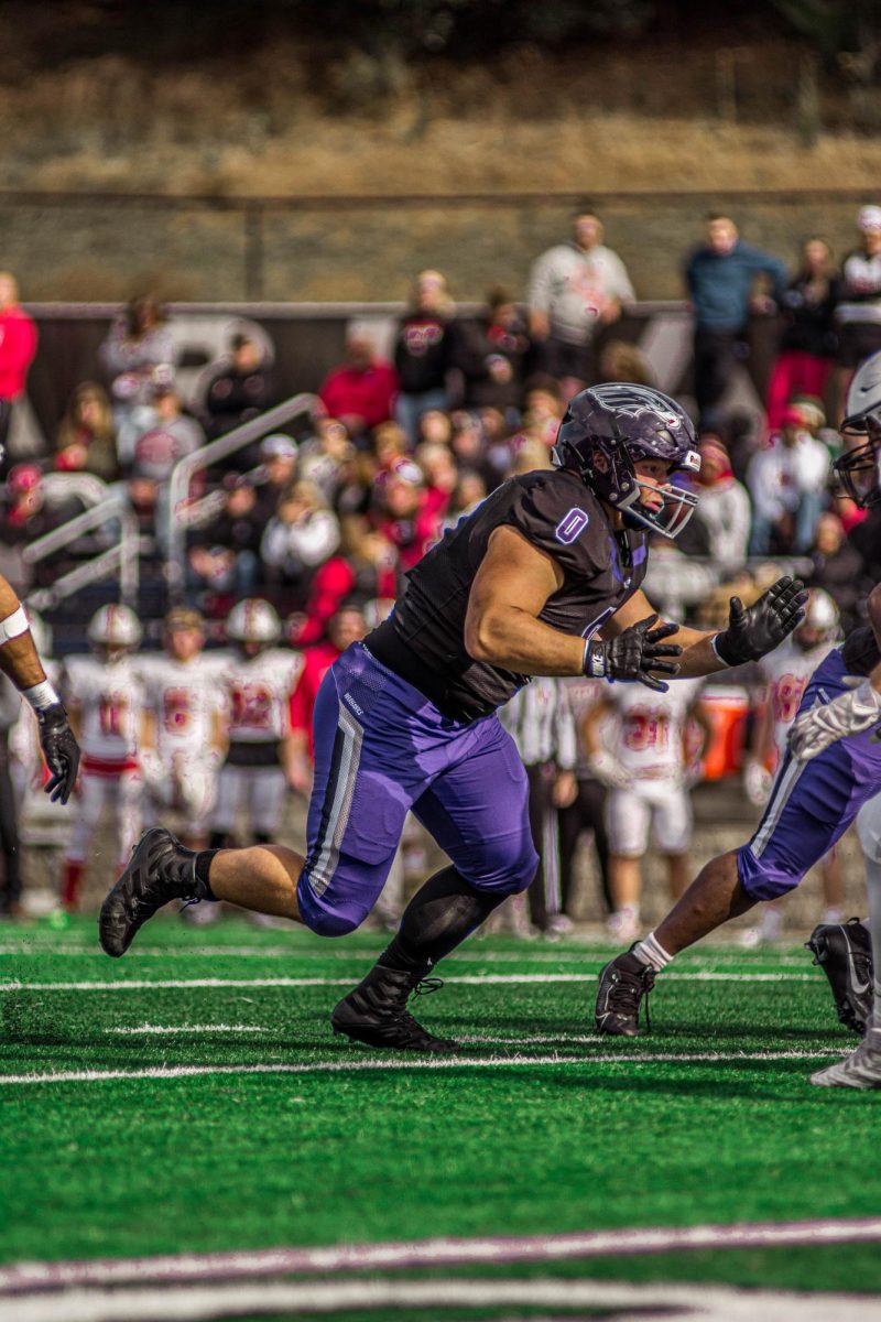 Senior defensive lineman, Matt Burba, rushing the quarterback at Perkins Stadium Sautrday, November 2nd.
