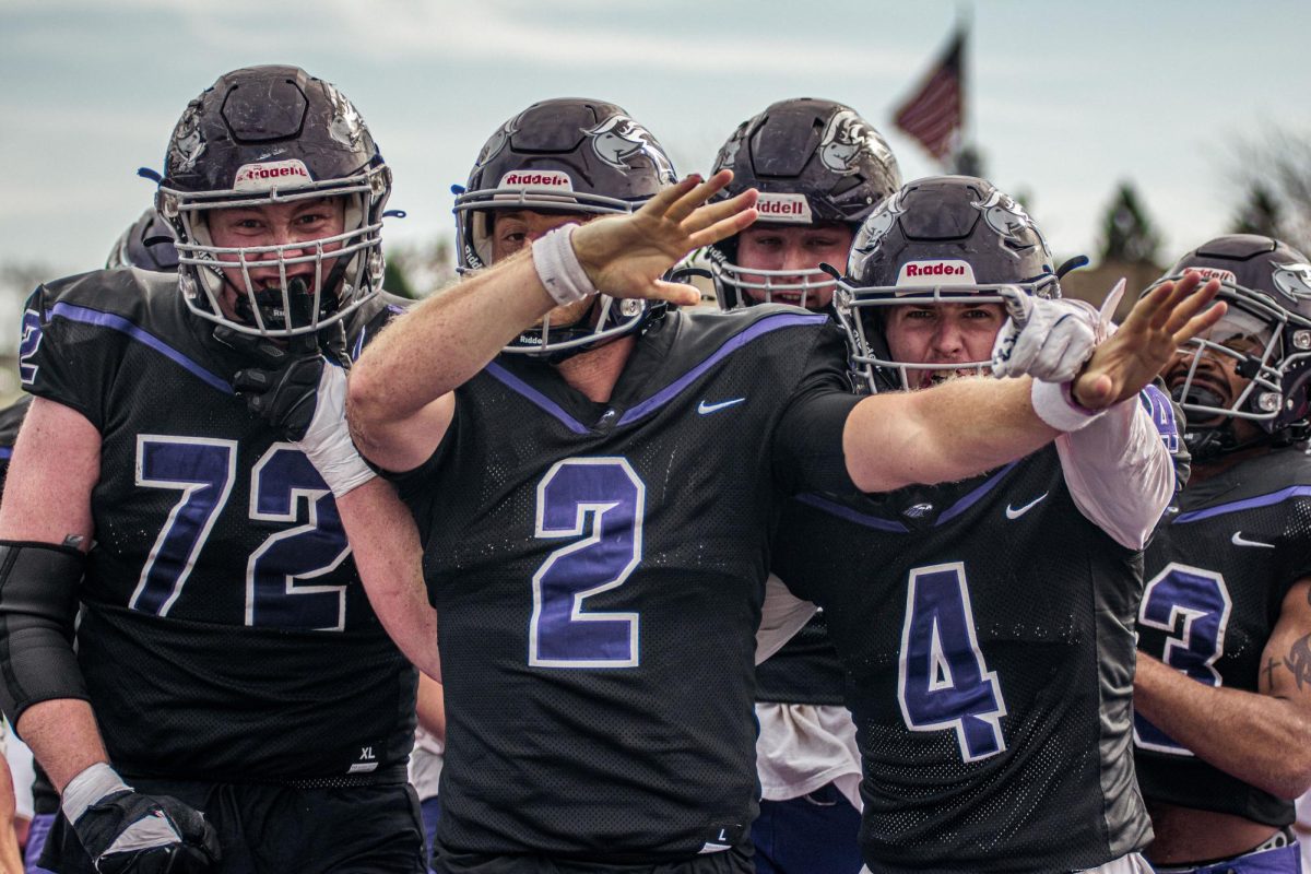 Sophomore, Colin Krzeczkowski, senior, Jackson Chryst, and senior, Nick Wind, celebrating a touchdown at Perkins Stadium Sautrday, November 2nd.
