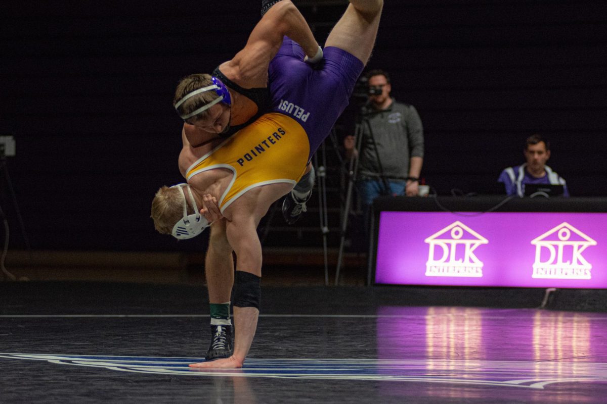 Gavin Kohel lifting a Stevens Point Wrestler at Kachel Gymnasium Friday, Nov. 15. 

