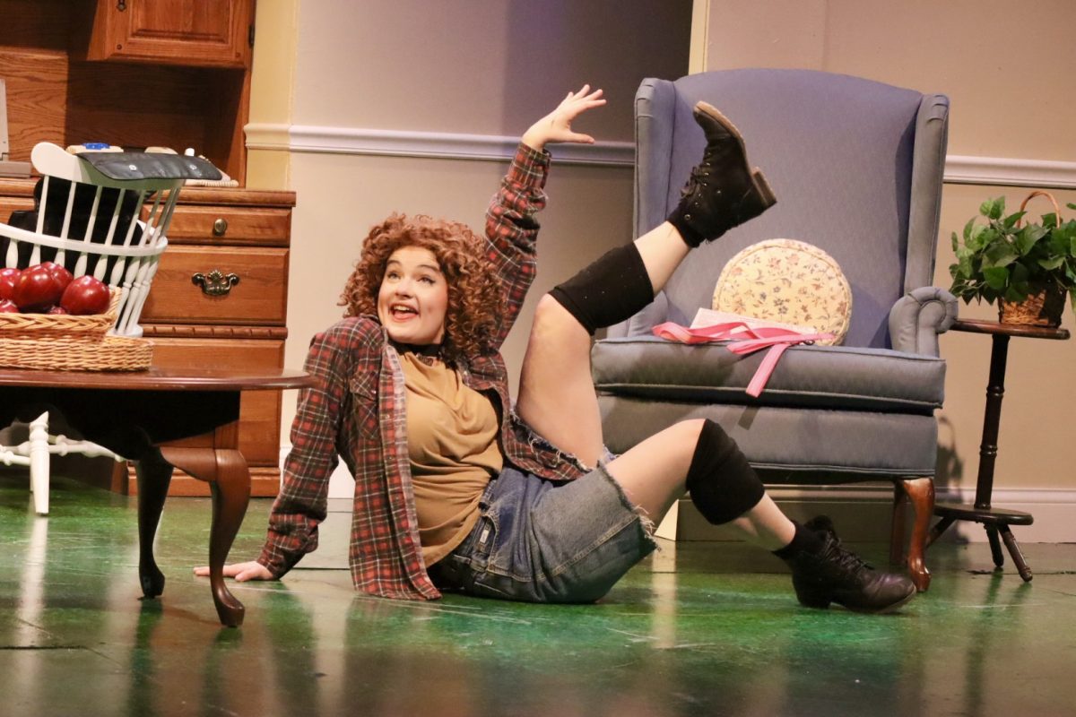 Abbey Frey who plays Sylvia the dog, shows off and strikes a pose during the last dress rehearsal, Thursday night, November 14, 2024.