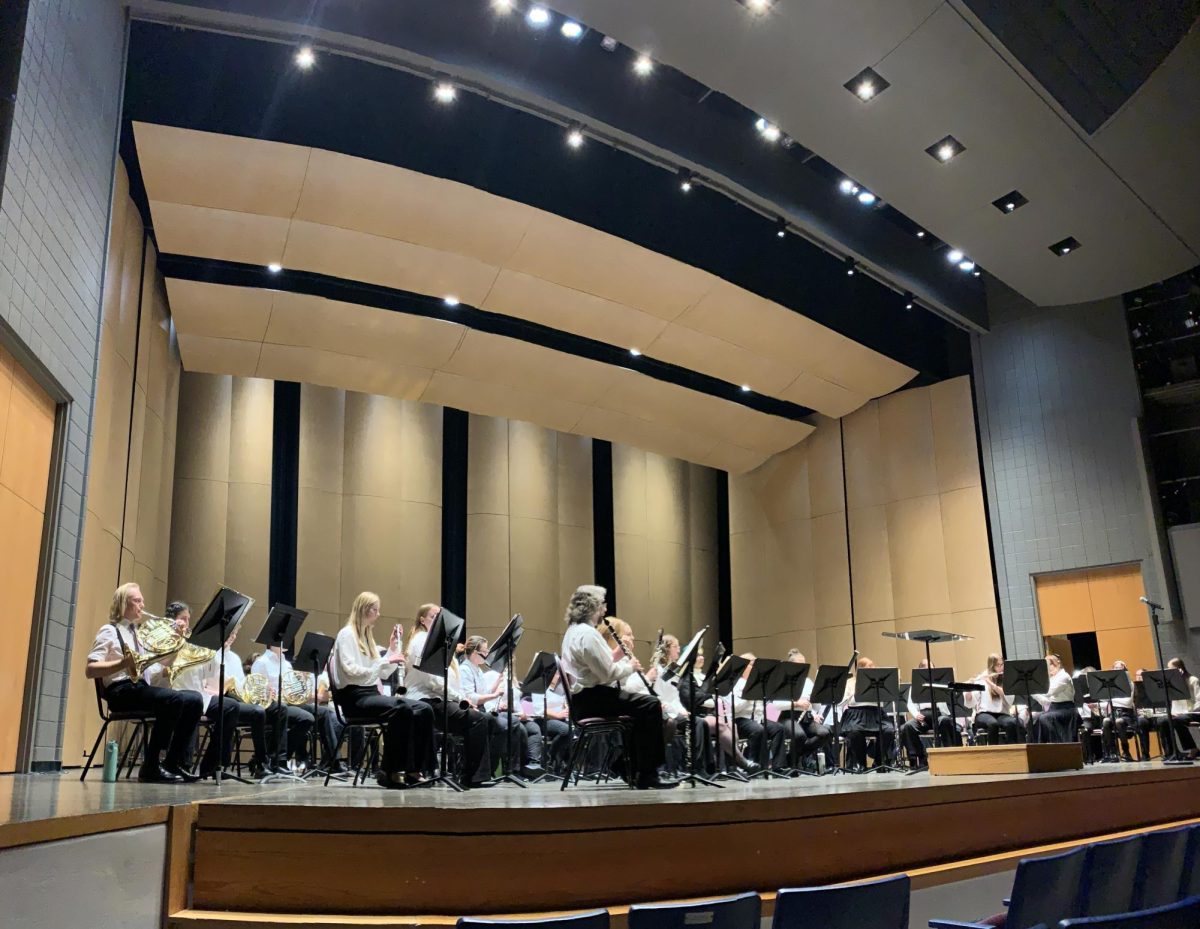 Thankful for all the joy it's bringing! Kicking off the week of Thanksgiving, the University & Community Band held their winter concert Nov. 25 to a full house in the Young Auditorium. This ensemble is made up of more than 30 students, recent alums, UW-W staff and other members of the Whitewater community. Musicians who participate in the Community Band range in ages from UW-Whiteater’s 18 year old freshmen to people who are at retirement age.
UW-W alumna, Kayla Glaser, has been a part of this ensemble since her freshman year in 2013. After graduating, Glaser has remained active in the Whitewater community in many ways. In addition to playing clarinet for the Community Band, she is the custom shop coordinator at the UW-Whitewater Bookstore. 
“I joined during my freshman year. Doctor Hayes had told me that it was a new, fun ensemble that was generally a bit less pressure than some of the other bands,” Glaser said. “Since I wasn't a music major, it was very appealing to me that this group didn't require auditions or chair placements. Everyone was accepted and encouraged to grow.”
What makes the Community Band so unique is it gives the opportunity for everyone to participate. A biology professor at UW-W, Kris Curran, has been part of the ensemble for the last five years.
“It’s a wonderful break from other things.” As a professor Curran doesn’t have a lot of free time and is appreciative to have this outlet for her passion for music. “I love to use my brain this way. Science and music work well together in life. Einstein played the violin. Many of my scientist friends from college also were really good musicians.”
As we enter winter and the many holidays it holds, many of us reflect on what's important to us. The sense of community is strengthened as people come together to share their time, their gratitude and their passions. In the audience for the concert were hundreds of family members and friends of the musicians who performed. The auditorium was filled with excitement both in the audience and on stage.
“I have met several of my very closest friends as a direct result of being in this ensemble,” Glaser said. “They have become such big parts of my life, and it's wild to think about how our paths may not have crossed without band.”
French horn player and current UW-W senior, Sam Behling, also talked about how important this ensemble has been to him. 
“This group is important to me because it allows me to have fun and keep music in my life,” Behling said. “I also really like that we allow members of the community to be a part of the band as well, be they alumni, music teachers, or people who just own an instrument.”
“For me, playing is an exhilarating experience,” Glaser said about her passion for music that she’s been able to continue to pursue because of the Community Band. “If you picture how exciting it feels to listen to a favorite song on repeat, it's kind of like that, except you hear the music all around you, you can feel the vibrations through the floor, and you have a direct impact on the sound. It's unlike anything else.”
