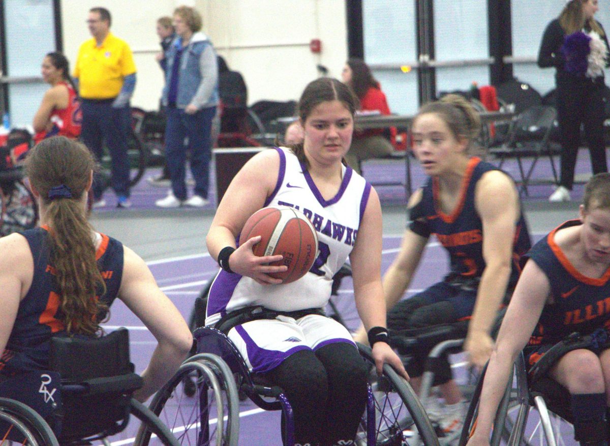 Mada McCabe (#32) takes the ball in stride against the University of Illinois.