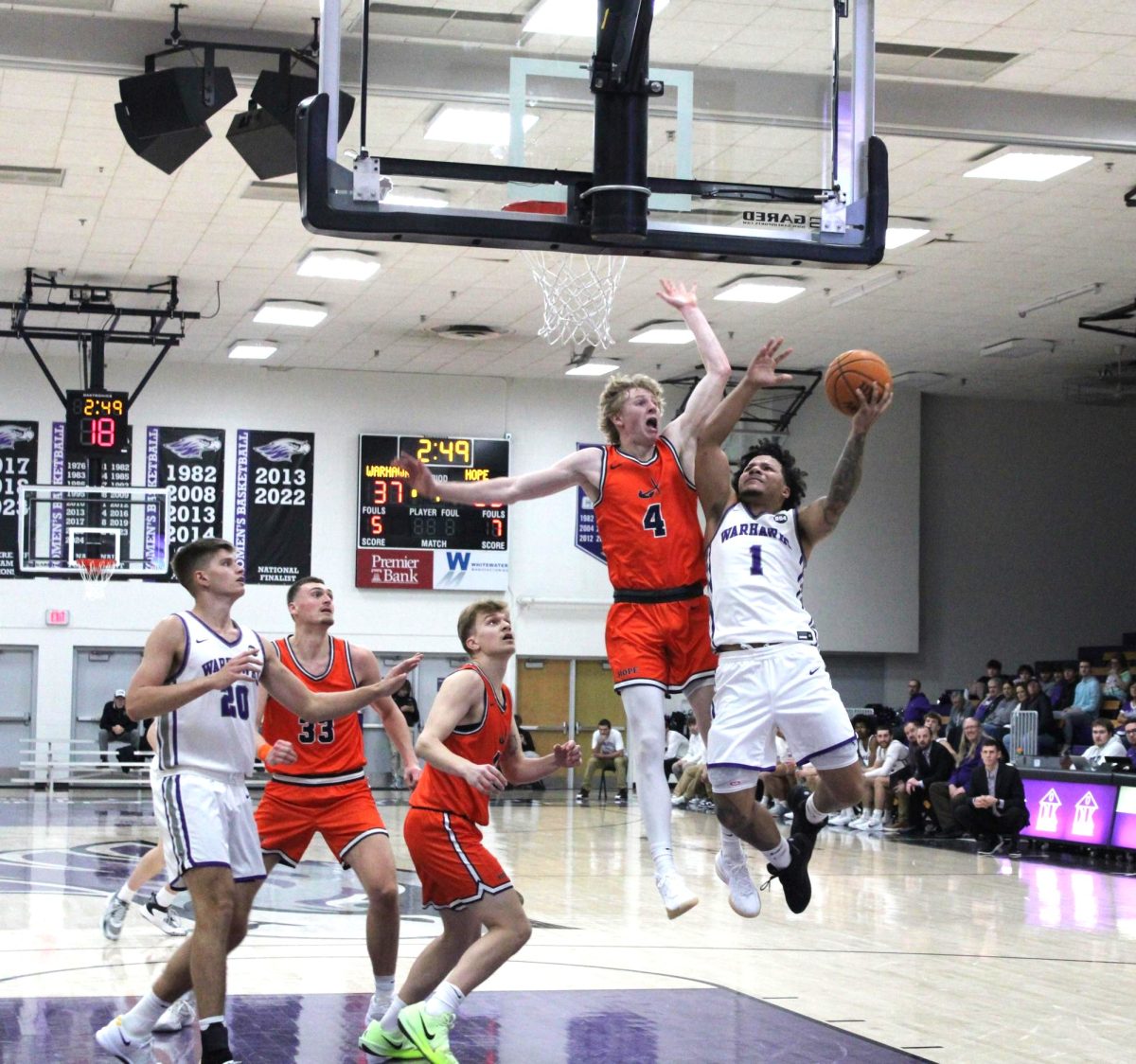 UW-Whitewater senior guard Jameer Baker goes up for an aggressive layup against Hope College against senior guard Sam Carlson in the Kachel Fieldhouse Gymnasium Dec. 6, 2024.