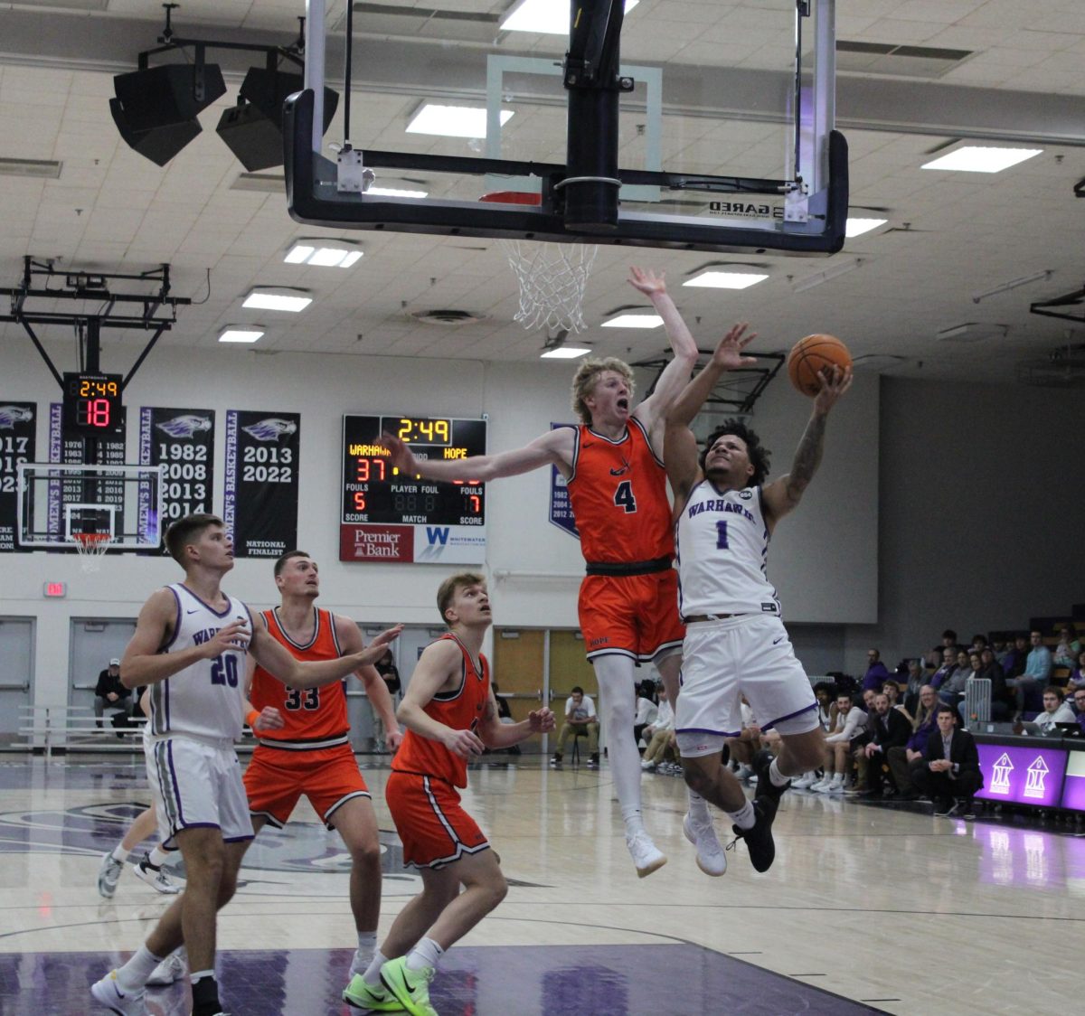 UW-Whitewater senior guard Jameer Baker goes up aggressively  for a layup against Hope College against senior guard Sam Carlson  in UW-Whitewater’s Kachel Gymnasium Dec. 6 2024.