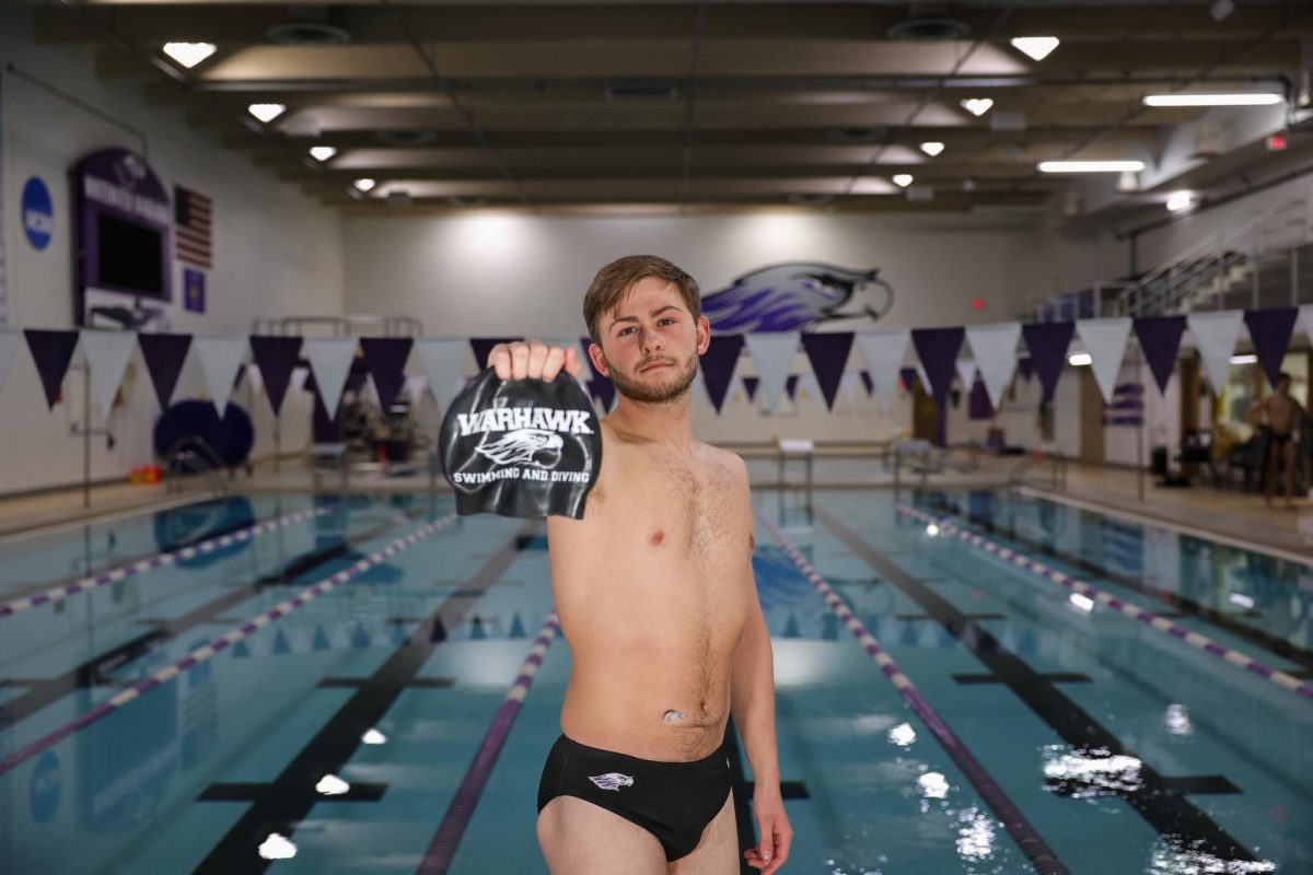 Sophomore swimmer Caleb Weis poses for a photo during the men’s swim and dive team’s media day.
