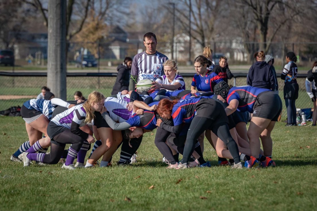 Grace Richter, part of the University of Whitewater-Wisconsin Women’s Club Rugby, leads the fight for the Rugby ball during their match located in Oshkosh against UW-Platteville on October 19th, 2024.