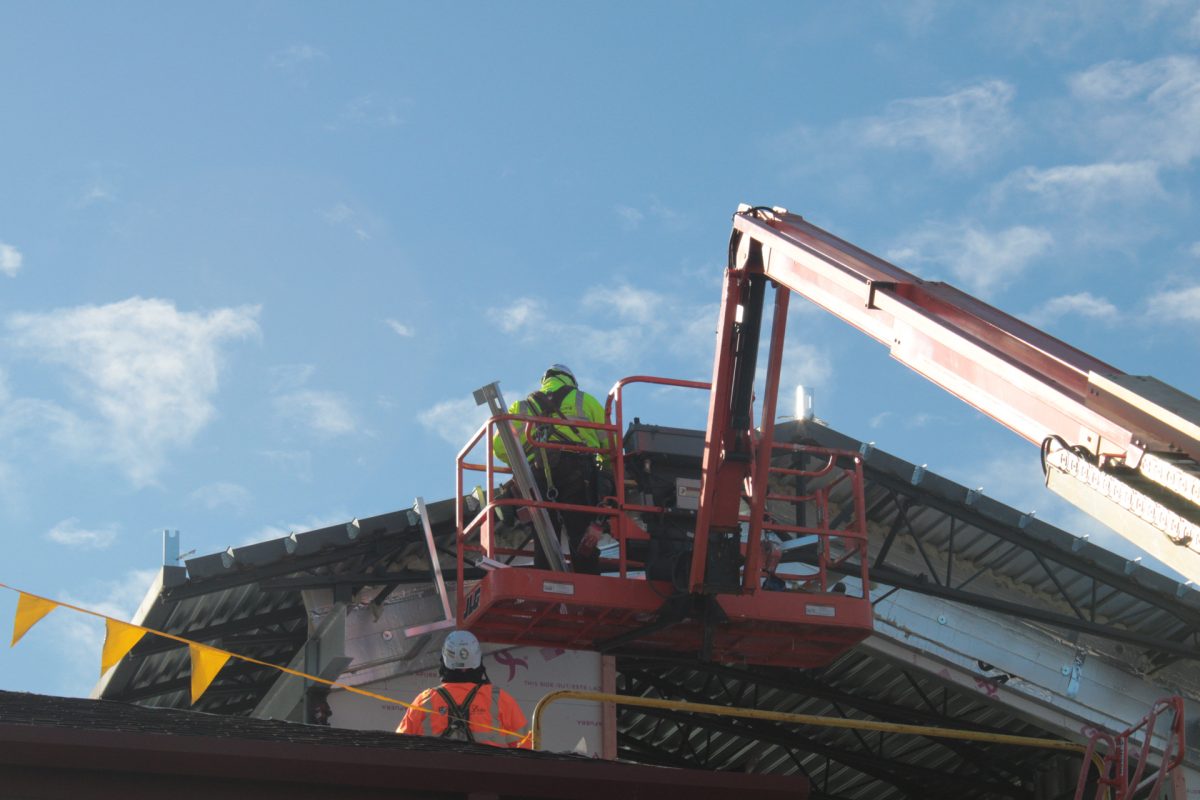 Construction Workers build on Irvin L. Young Memorial Library for expansion project
