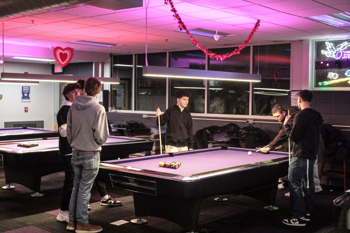 Delta Chi brothers enjoying their time together playing pool for their Spring Rush event in the UC bowling alley Feb. 6, 2025.