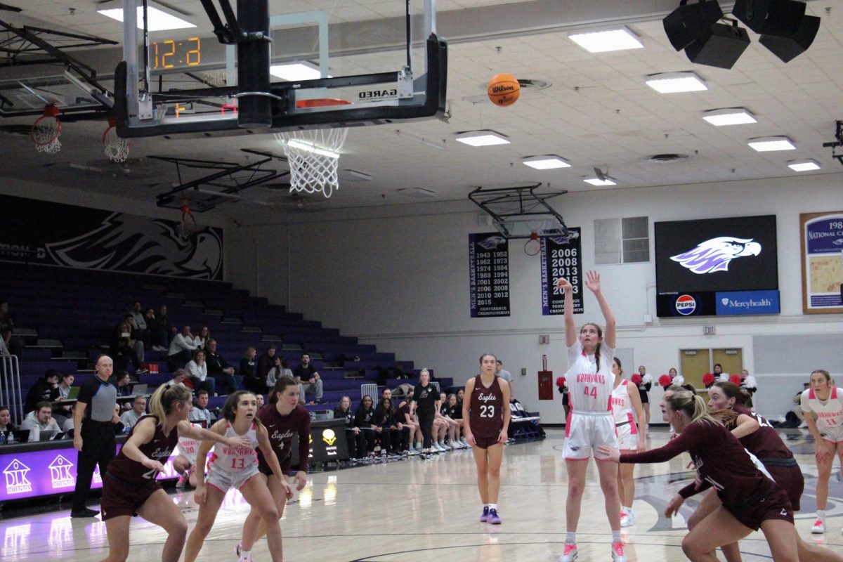 Senior Katie Hildebrandt shooting her second free throw while her teammates prepare to get possession of the possible rebound at the home game against UW-Lacrosse on February 12, 2025.