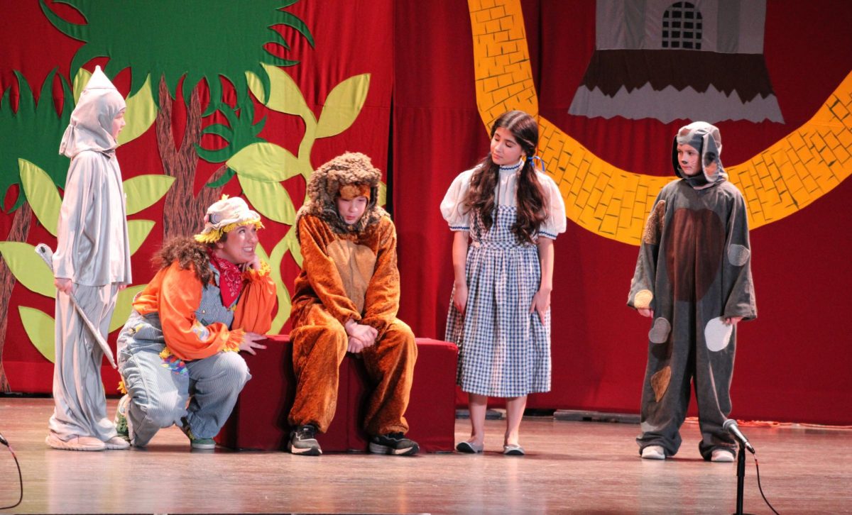 The Tin Man(Karleigh Klietz), Scarecrow(Maddy Ballard), Lion(James Peterson), Dorothy(Serina Soto), and Toto(Leah Lenartowski-Schramm) act out a scene in the Missoula Children’s Theatre production of The Wizard of OZ performed at UW-Whitewater's The Young Feb. 9 2025.