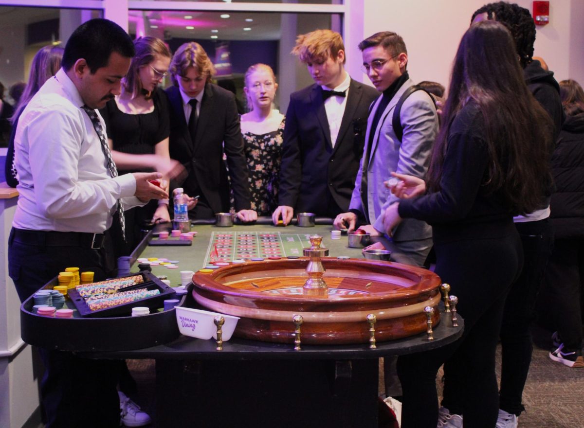 UW-Whitewater students try their luck at the roulette table during UW-Whiterwater’s Winterfest Casino night in the University Center, Jan. 31, 2025.