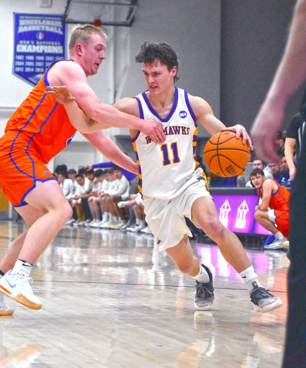 UW-Whitewater Men’s Basketball senior guard JT Hoytink dribbles passes UW-Platteville Men’s Basketball team as he looks for a shot or a pass on February 19th, 2025 in the Kachel Fieldhouse Gymnasium.