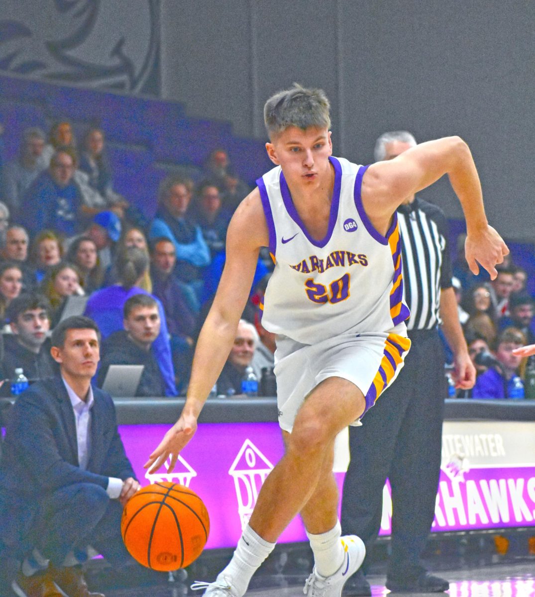 UW-Whitewater junior forward Austin Ambrose dribbles down the court against UW-Stout on February 8th, 2025 in the Kachel Fieldhouse Gymnasium.
