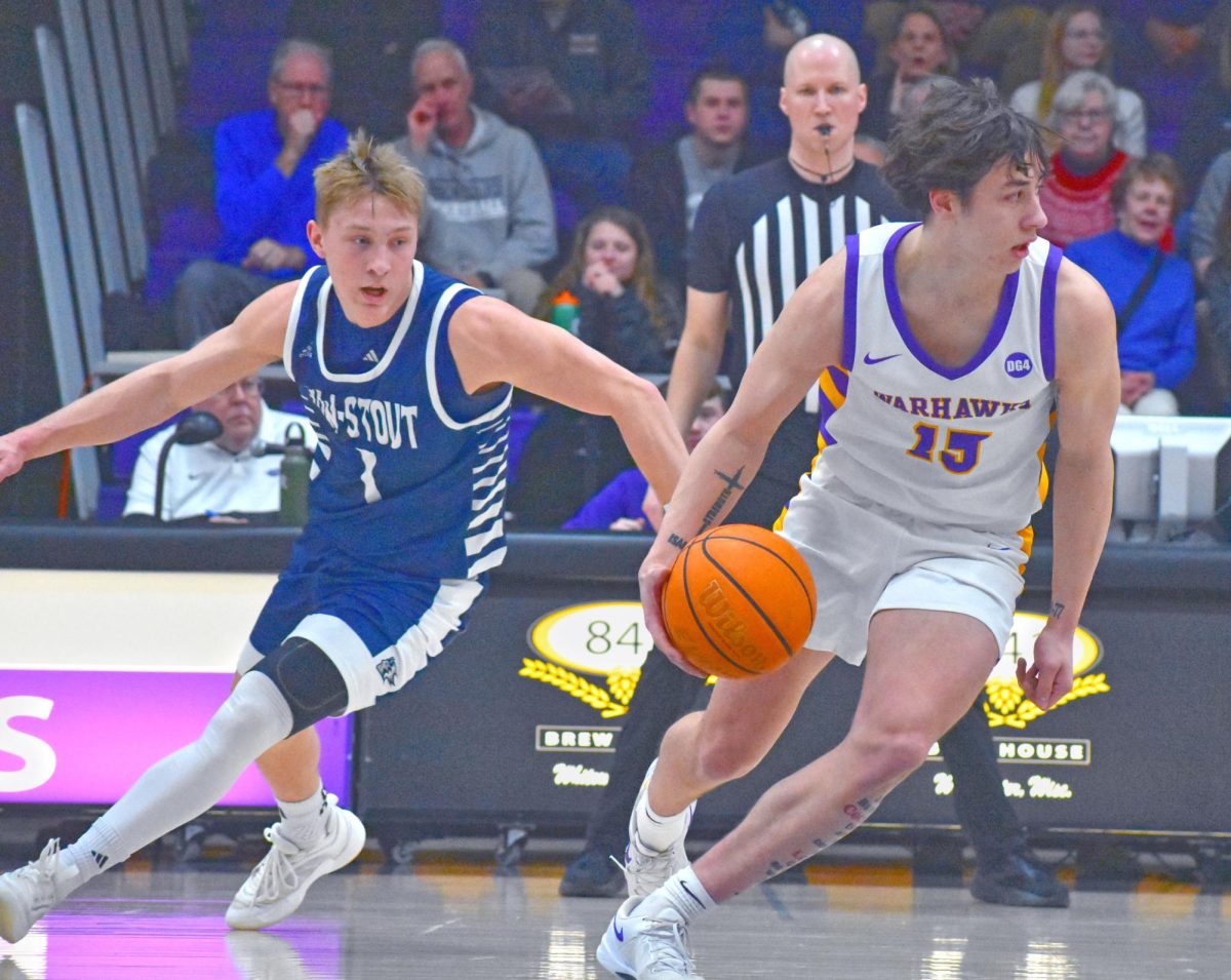 UW-Whitewater sophomore guard Collin Madson dribbles past UW-Stout sophomore guard AJ Uttech to advance the ball on Feb. 8th, 2025 in the Kachel Fieldhouse Gymnasium.