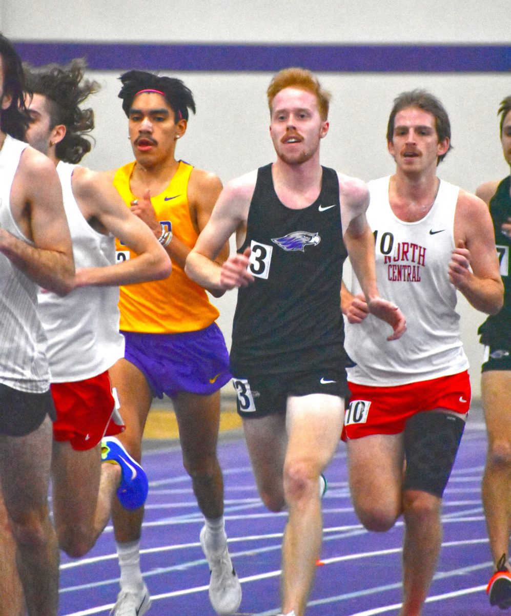 University of Wisconsin-Whitewater junior Jonah Block runs past his competitors in the Men's 5000 meters for the Midwest Elite Meet on February 14th, 2025 in the D.L.K. Kachel Fieldhouse.