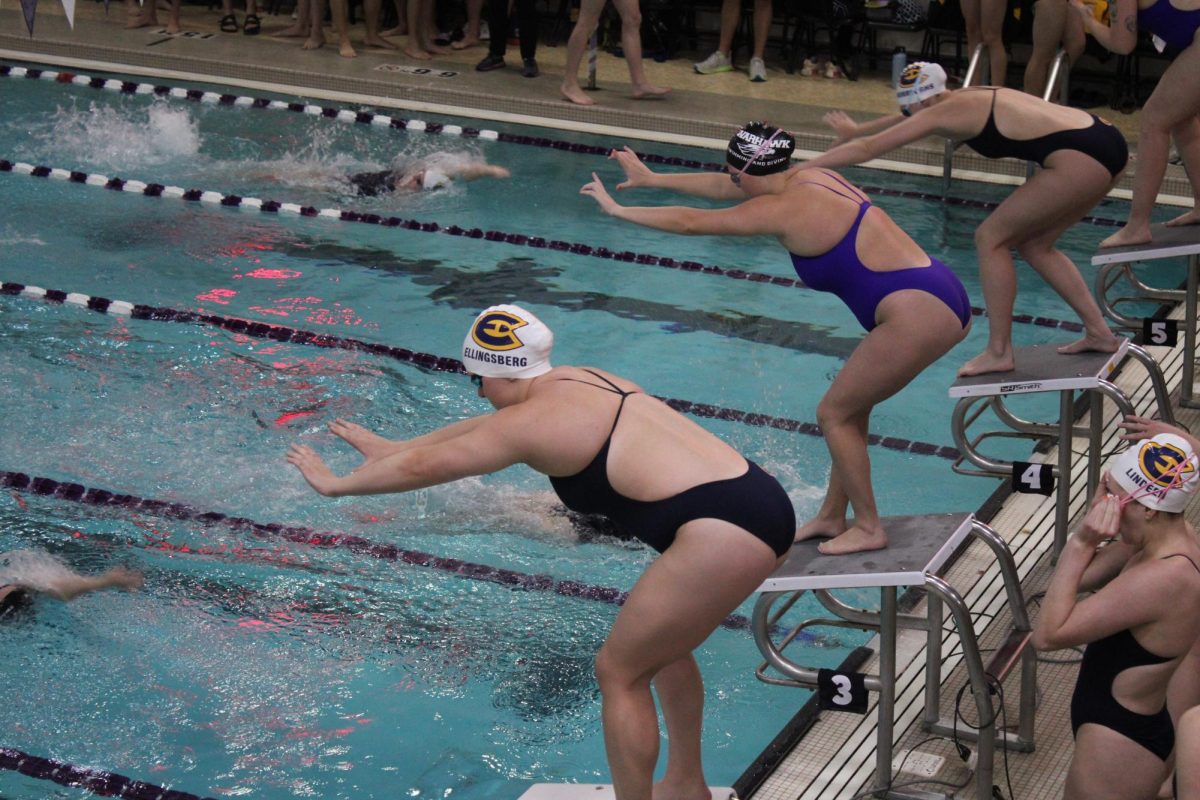 Swimmers getting ready for the first event in the Women 200 Yard Medley
Relay in the Williams Center for the UWW vs UWEC meet Feb. 1, 2024.