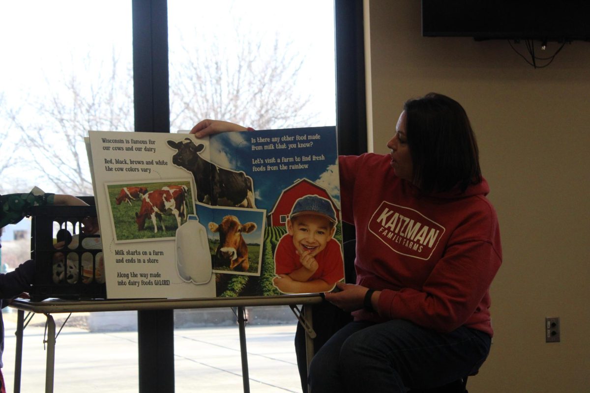  Katy Katzman reads a book about the different colors of the rainbow that can be found on a farm during the Community Helpers storytime hosted by Irvin L. Young Memorial Library on March 12 at the Cravath Lakefront Community Center.


