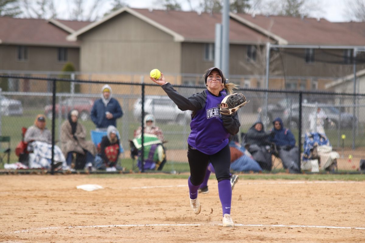 Grace Wickman, throwing the ball to first base, finished the 2024 season with a .970 fielding percentage.