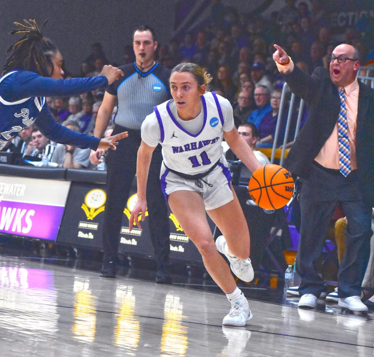 UW-Whitewater Women’s Basketball senior guard Maggie Trautsch dribbles through the court looking for an open pass against Principia College in the NCAA tournament on March 7th, 2025 in the Kachel Gymnasium.