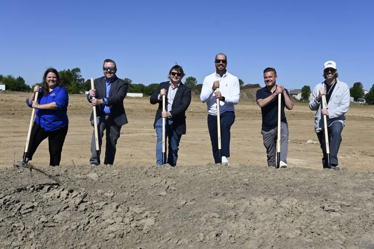 Leaders of the Hartland Shores residential development and City of Whitewater dig their shovels into the fresh dirt at the groundbreaking site southeast of town Tuesday, Aug. 26.