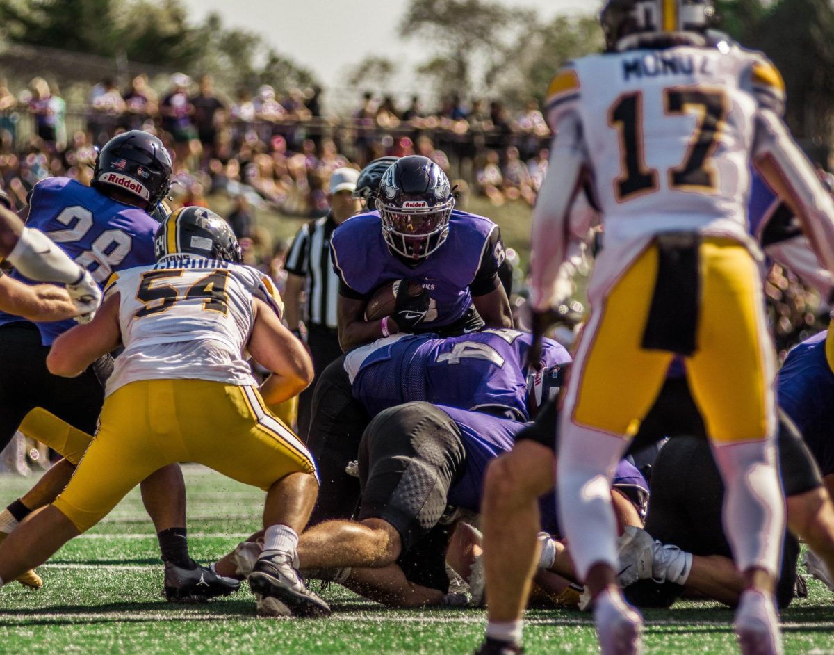 Running Back, Tamir Thomas, running the ball against UW-Oshkosh at Perkins Stadium Oct. 5th, 2024