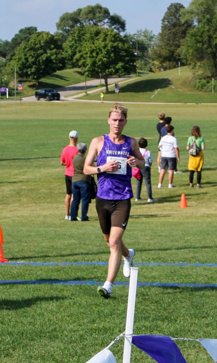 UW-Whitewater runner Dan Anderson crosses the finish line on the west side of the Kachel Field House at the Intramural Fields during the Tom Hoffman Invitational on Sept. 20th, 2025. 