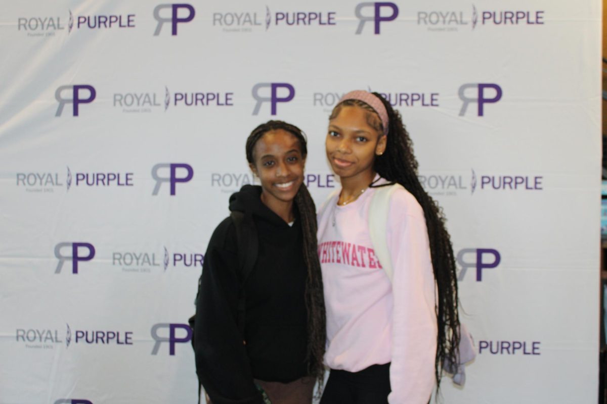 A pair of students pose for a photo at the Royal Purple booth in the Fall 2025 Involvement Fair, Wednesday Sept. 10 at UW-Whitewater.