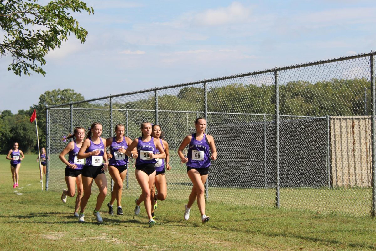 UW-Whitewater’s Woman Cross Country take the lead as a squad to maintain the course together at the Intramural Fields during the Tom Hoffman Invitational on Sept. 20th, 2025.