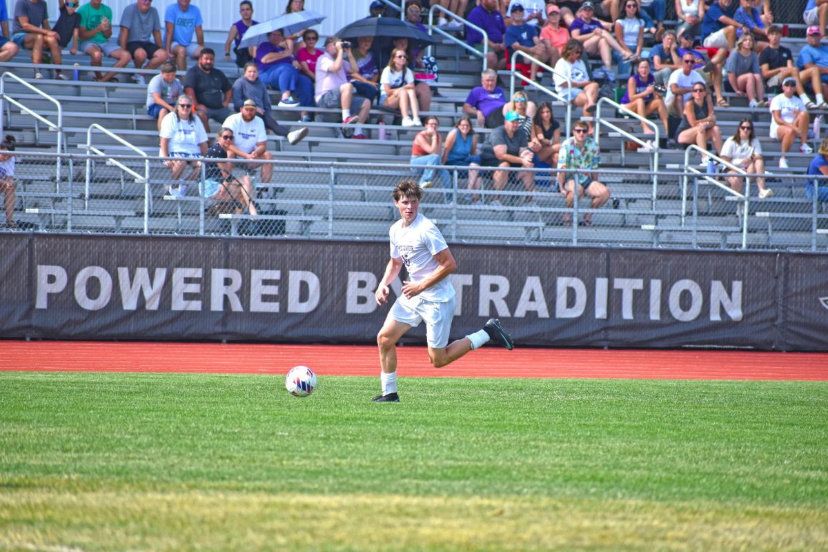 UW-Whitewater Men’s Soccer junior forward Hayden Saul plays the ball up the field against Augsburg University on September 13th, 2025 at Fiskum Field.