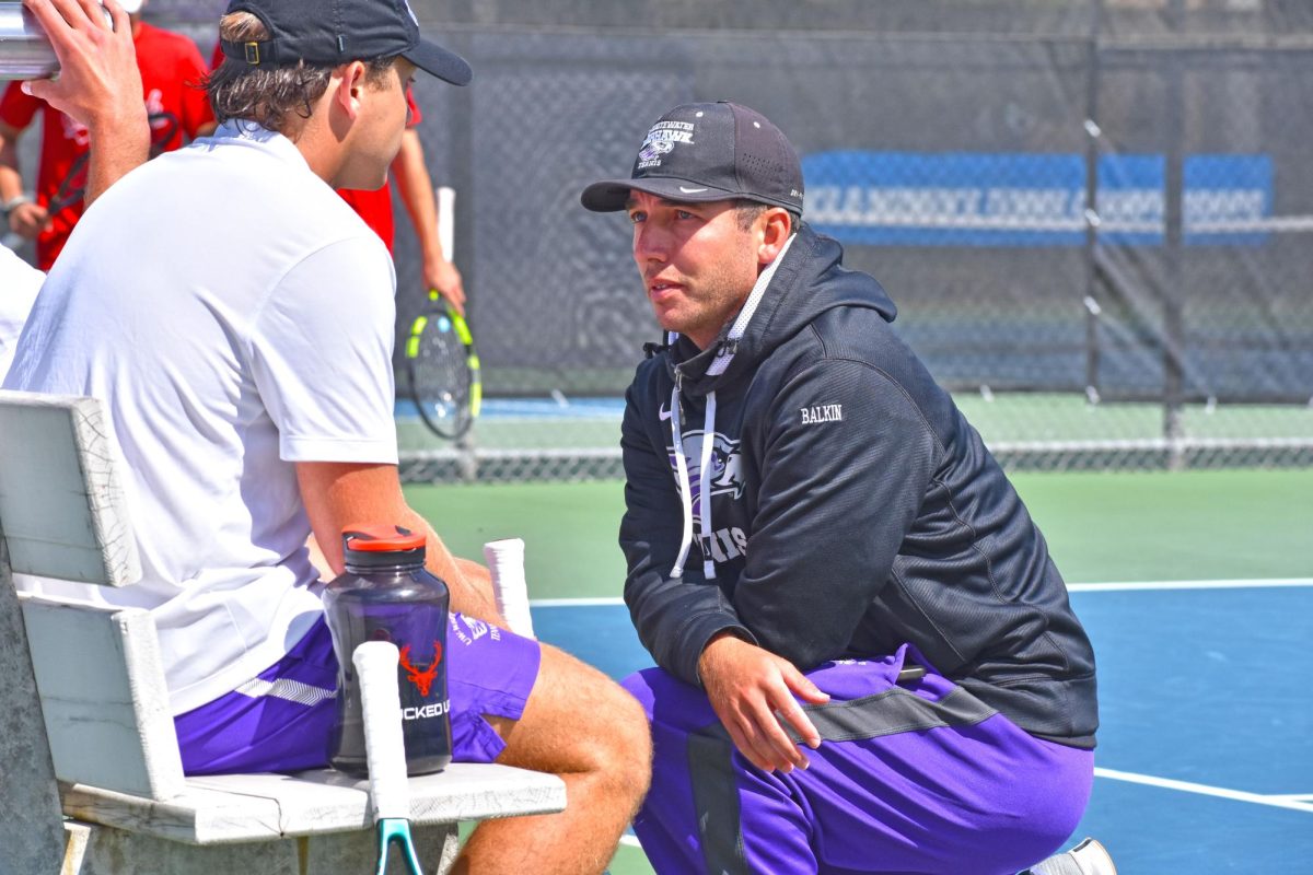 UW-Whitewater Tennis Coach Byron Balkin communicates with UW-Whitewater Men’s Tennis players about their next strategy at the Warhawk Men’s Fall Invite on September 5th, 2025 at the Wangerin Tennis Courts.
